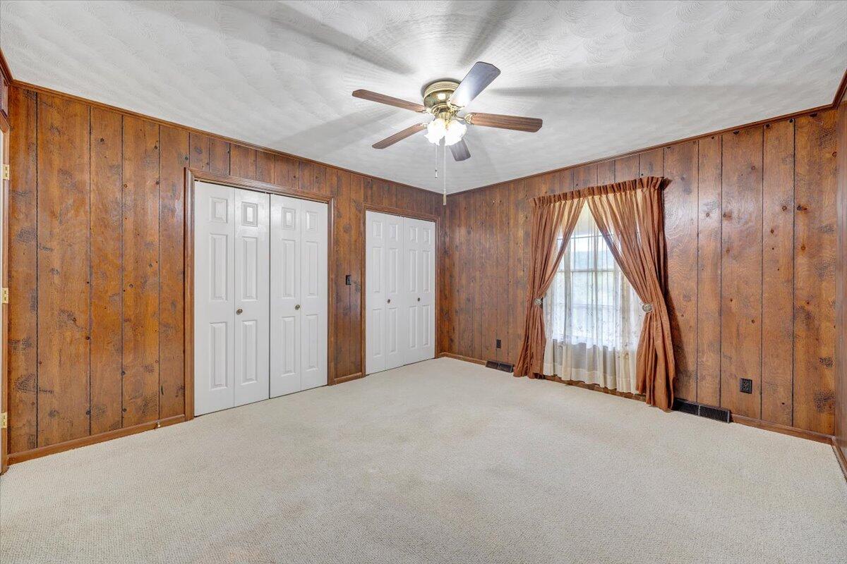 3737 Bore Auger Road Blue Ridge, VA 24064 - Photo 36 of 100 an empty room with windows and fan