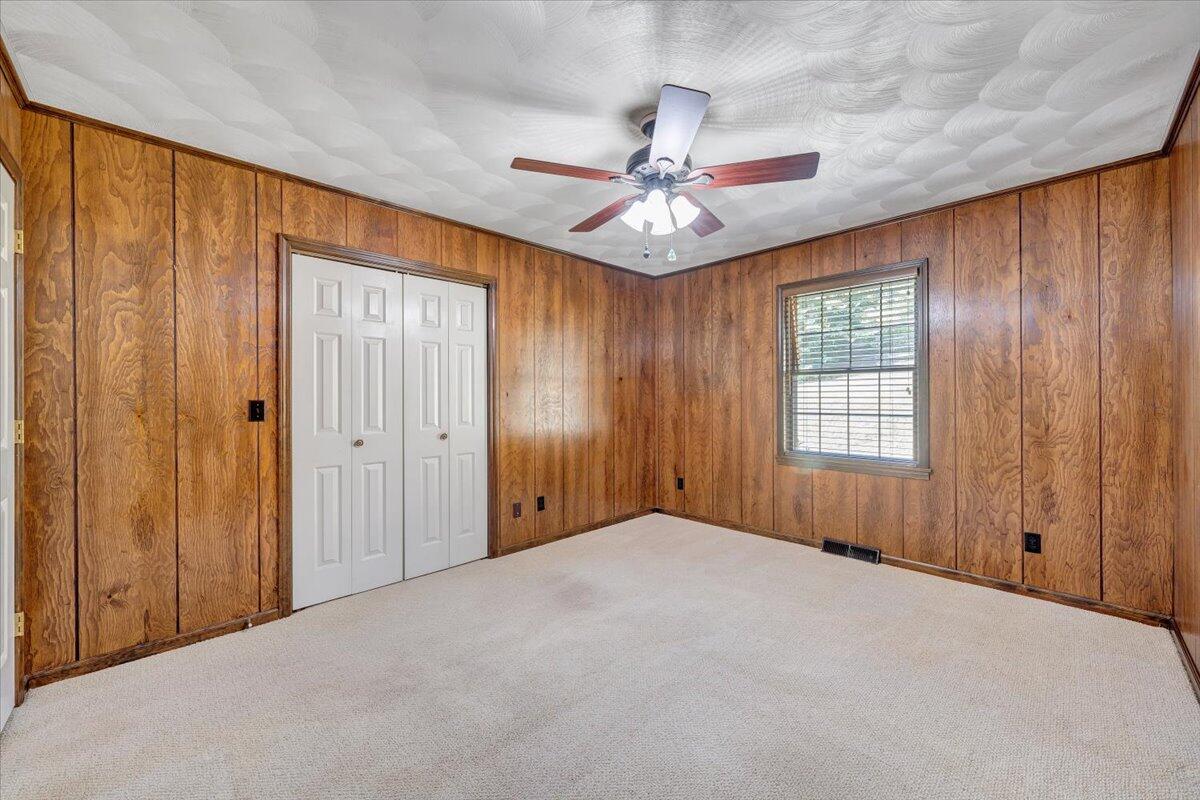 3737 Bore Auger Road Blue Ridge, VA 24064 - Photo 38 of 100 an empty room with windows and fan