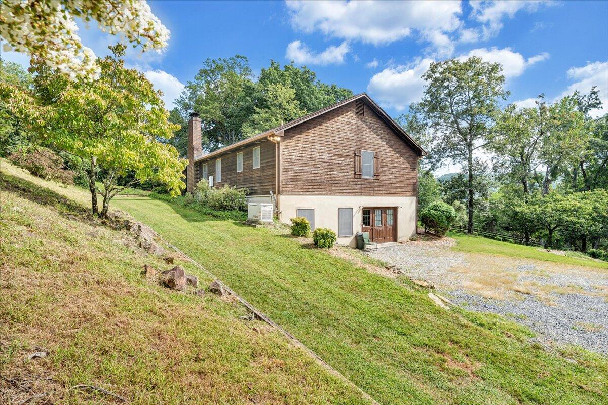 3737 Bore Auger Road Blue Ridge, VA 24064 - Photo 68 of 100 a view of a house with a yard