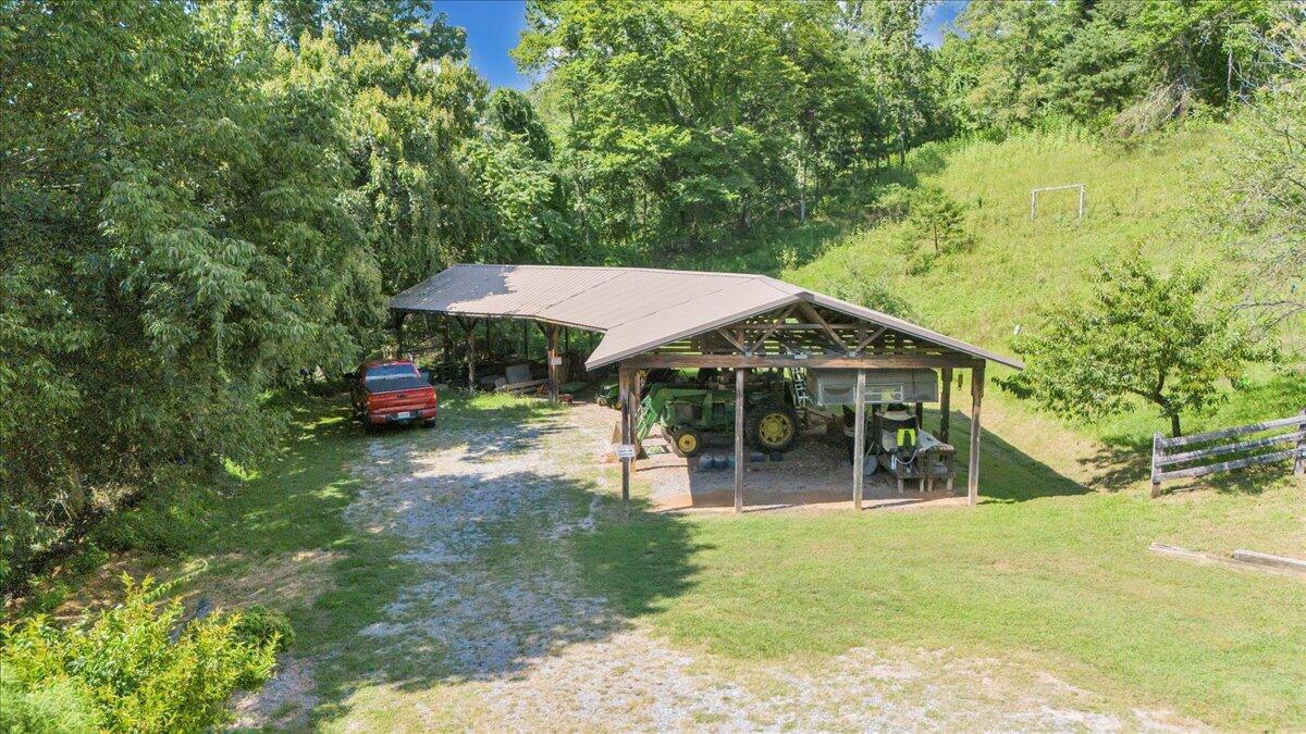 3737 Bore Auger Road Blue Ridge, VA 24064 - Photo 86 of 100 a view of a house with backyard and sitting area