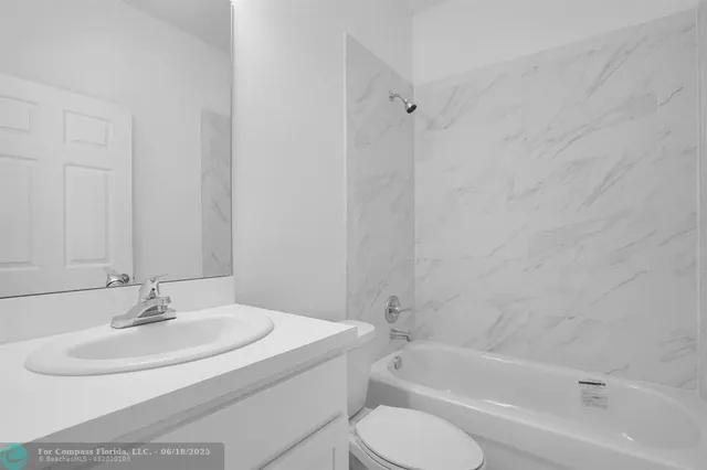 a bathroom with a sink toilet and a bathtub