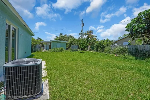 a backyard of a house with lots of green space