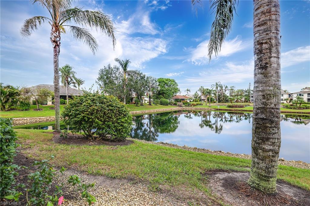 84 Georgetown Boulevard, Unit 84 Naples, FL 34112 - Photo 15 of 17 a view of a lake with a big yard