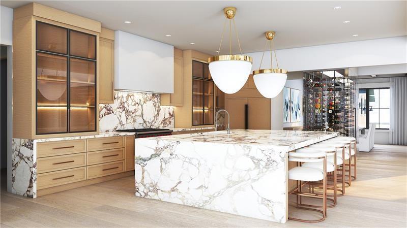 250 Mayfield Road Alpharetta, GA 30009 - Photo 3 of 24 a large kitchen with kitchen island a stove a sink and a dining table with wooden floor