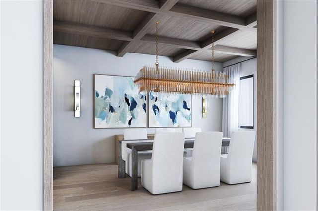 a view of a room with painting on the wall