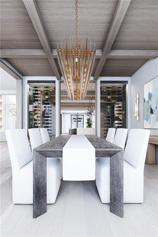 a living room with furniture a chandelier and a large window