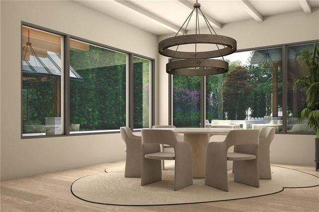 a living room with patio furniture and a large window