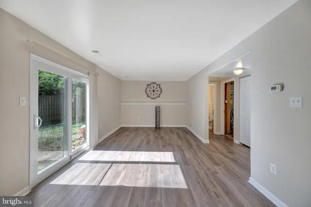 a view of a room with wooden floor garden and outdoor space