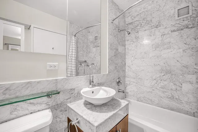 a kitchen with stove and cabinets