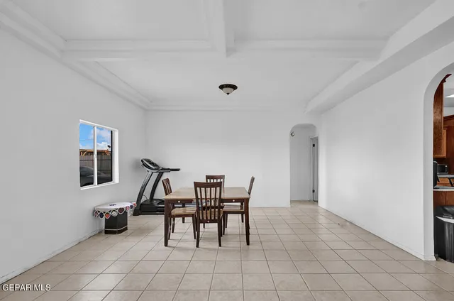 a kitchen with kitchen island granite countertop stainless steel appliances a stove refrigerator and a center island