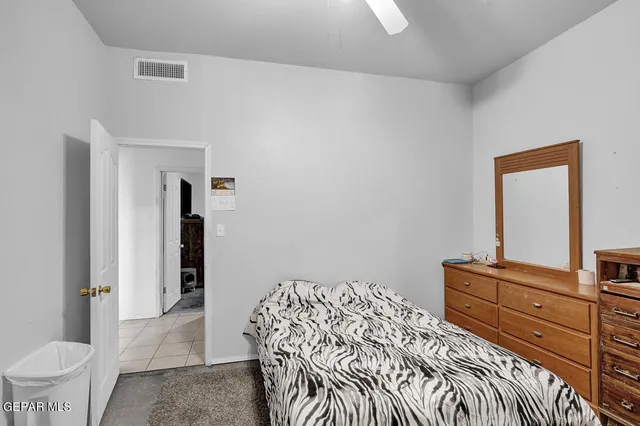 a bathroom with a sink a mirror a toilet and a shower