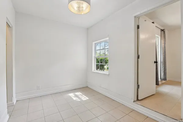 a view of an empty room and window