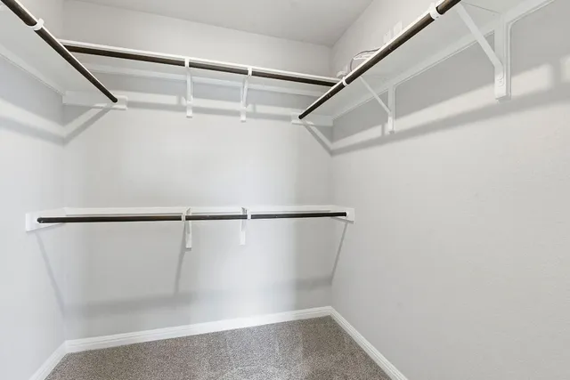 a bathroom with a shower sink and mirror