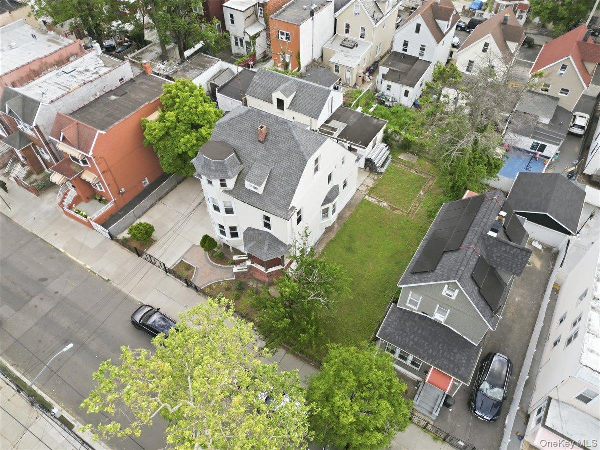 844-48 East 215th Street Bronx, NY 10467 - Photo 10 of 13 an aerial view of a house with a garden