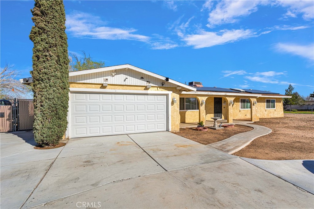 14030 Jicarilla Road Apple Valley, CA 92307 - Photo 1 of 1 a view of a house with backyard and porch