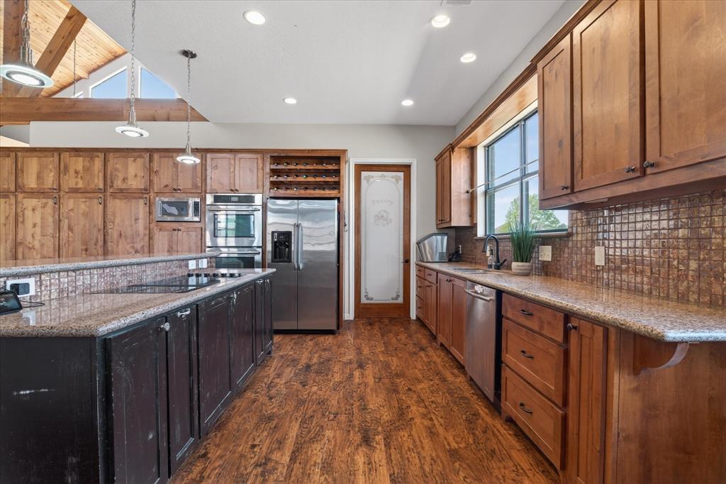611 Mohawk Street Tioga, TX 76271 - Photo 9 of 37 Kitchen with double ovens, built in microwave, cooktop, two large pantries and lots of counter space!