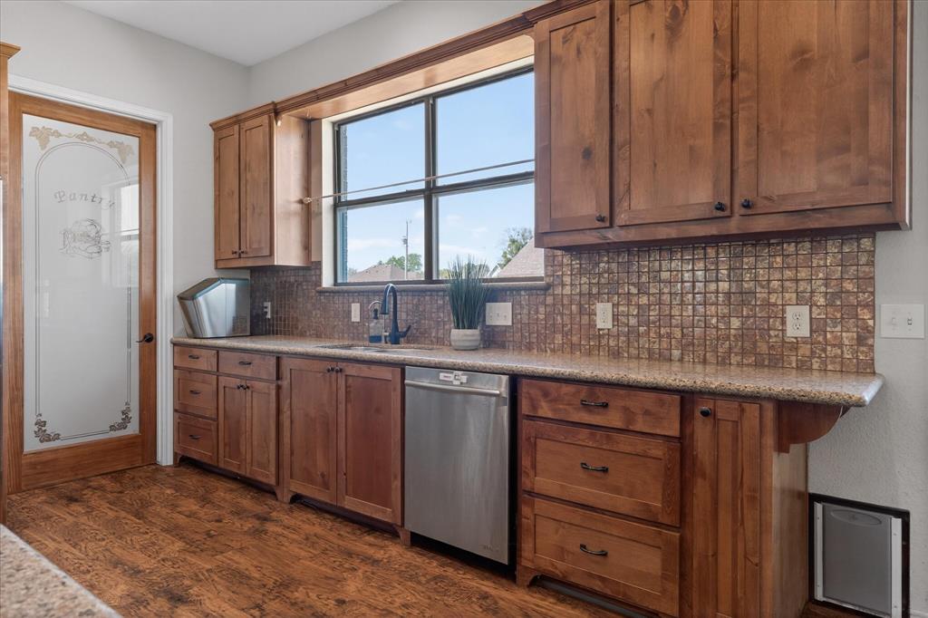 611 Mohawk Street Tioga, TX 76271 - Photo 12 of 37 Doggie door exits to a fenced in grass area!