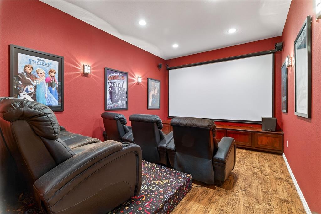 611 Mohawk Street Tioga, TX 76271 - Photo 23 of 37 Media room equipped with seating and projector equipment, included.