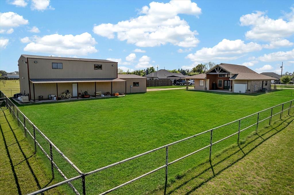 611 Mohawk Street Tioga, TX 76271 - Photo 3 of 37 Beautiful back yard with covered patios on the house and shop. Great for entertaining!