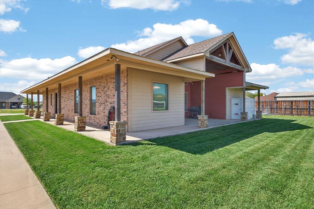 611 Mohawk Street Tioga, TX 76271 - Photo 31 of 37 Wrap around porch to back patio, Storm shelter is included in the sale.