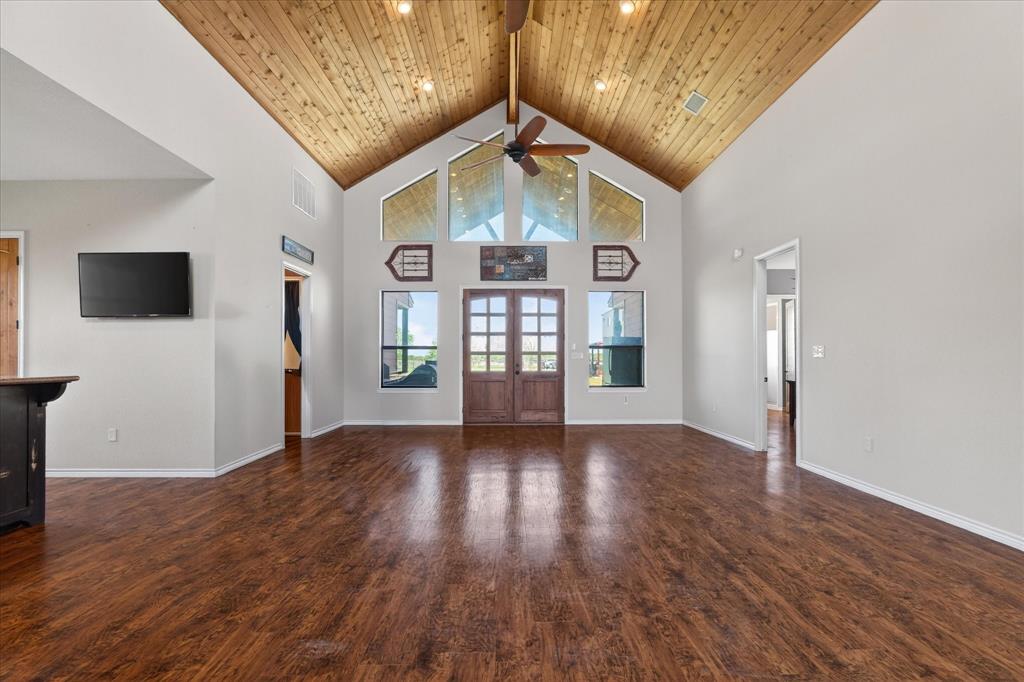 611 Mohawk Street Tioga, TX 76271 - Photo 7 of 37 Huge double wood doors open to the covered back patio.