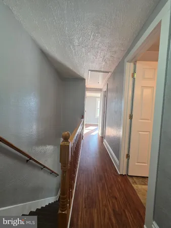 an empty room with wooden floor