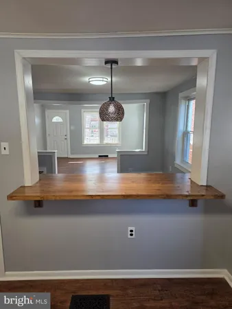 a front view of a house with a large window