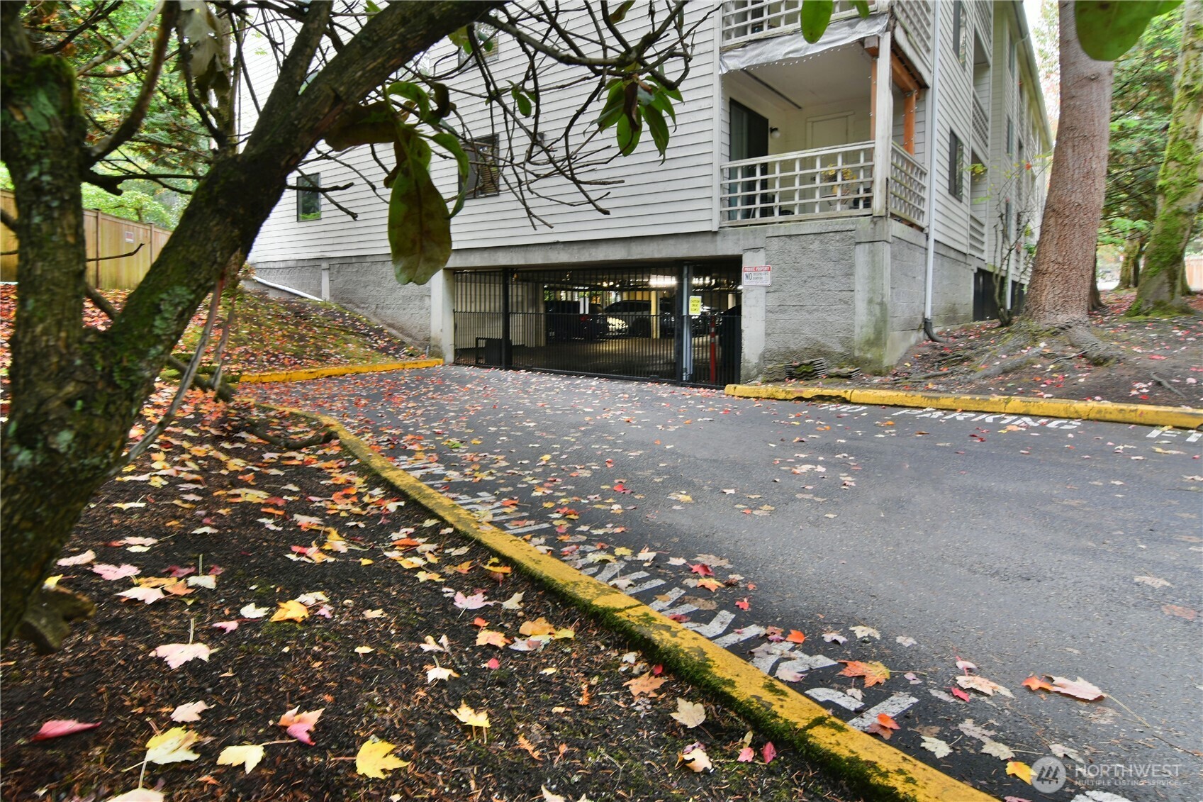 700 North 160th Street, Unit A314 Shoreline, WA 98133 - Photo 18 of 22 a front view of a house with a yard and garage