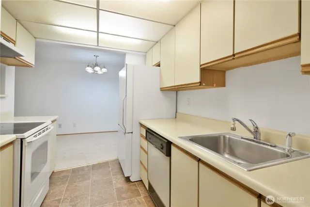 a kitchen with a sink and cabinets