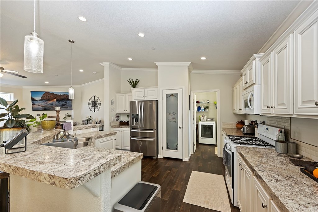 23161 Forrest Road Perris, CA 92570 - Photo 12 of 43 a kitchen with stainless steel appliances granite countertop a refrigerator oven a sink a stove and a refrigerator