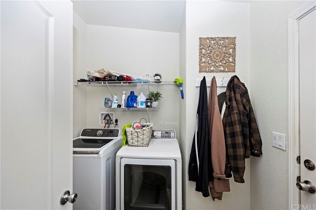 23161 Forrest Road Perris, CA 92570 - Photo 19 of 43 a view of walk in closet with clothes and shoes