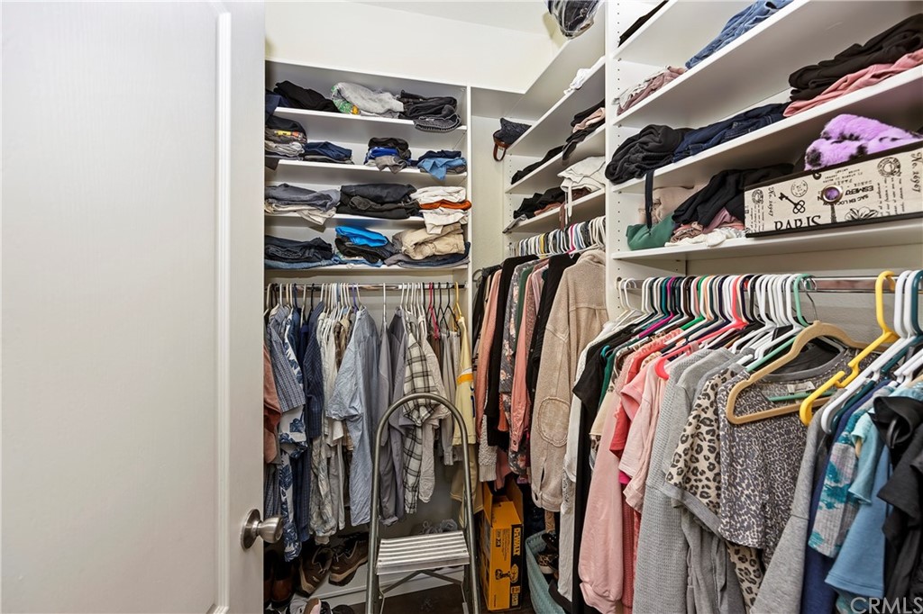 23161 Forrest Road Perris, CA 92570 - Photo 23 of 43 a view of walk in closet with clothes and shoes