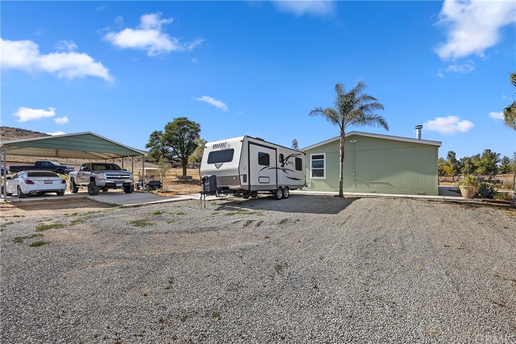 23161 Forrest Road Perris, CA 92570 - Photo 29 of 43 a car parked in front of a house