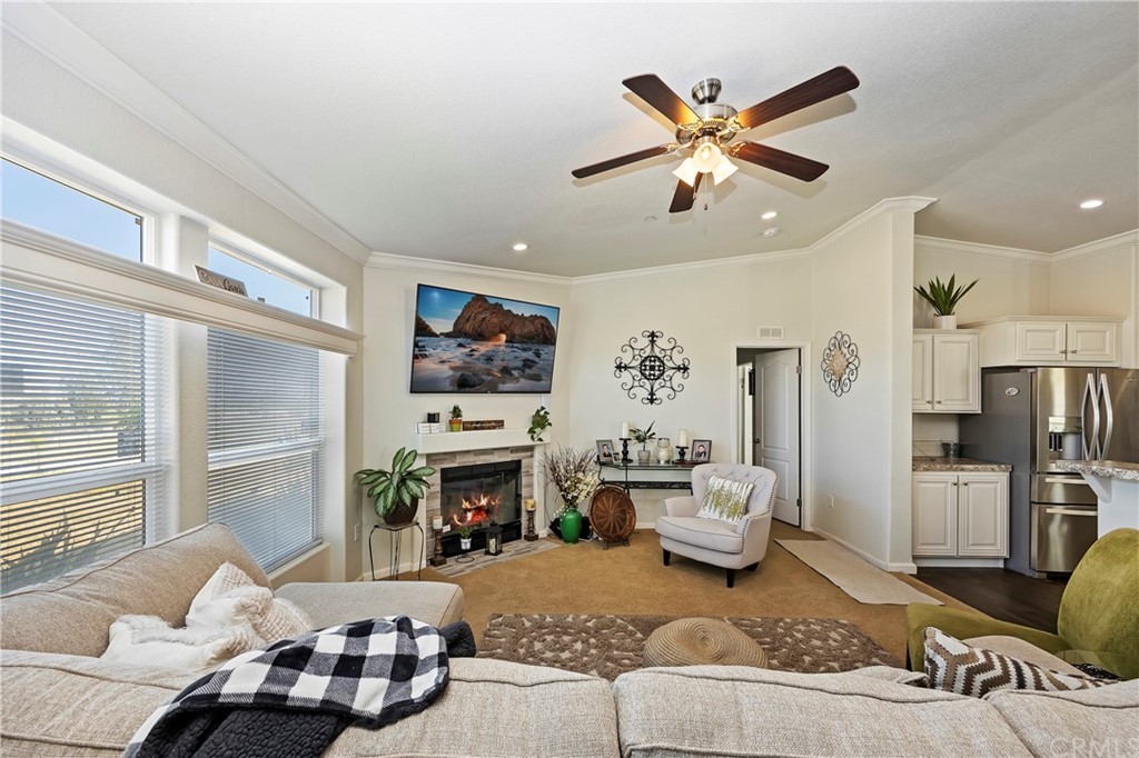 23161 Forrest Road Perris, CA 92570 - Photo 9 of 43 a living room with furniture a fireplace and a large window