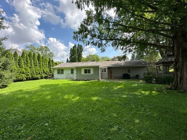 224 Maple Lane Geneva, IL 60134 - Photo 12 of 12 a front view of a house with garden