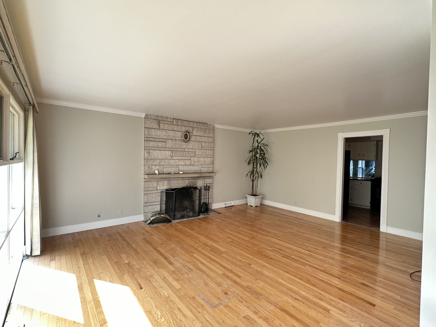 224 Maple Lane Geneva, IL 60134 - Photo 2 of 12 a view of empty room with wooden floor and fireplace