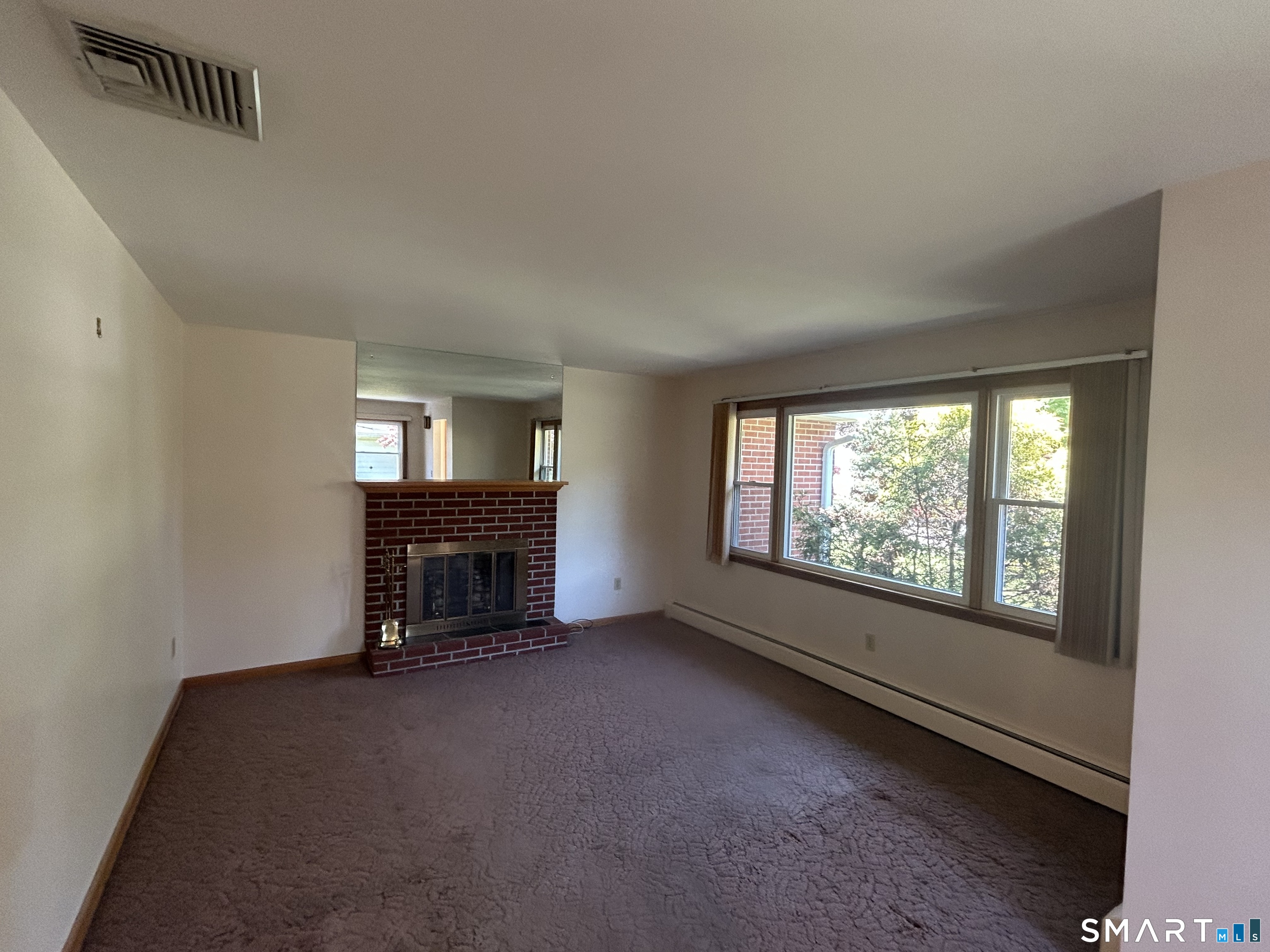 13 Walnut Lane Wallingford, CT 06492 - Photo 3 of 27 a view of an empty room with a window