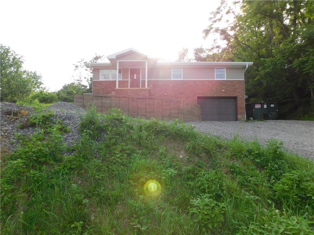 110 Auto Auction Road Uniontown, PA 15401 - Photo 3 of 7 a front view of a house with a yard