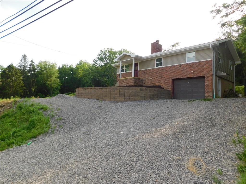 110 Auto Auction Road Uniontown, PA 15401 - Photo 7 of 7 a front view of a house with a yard