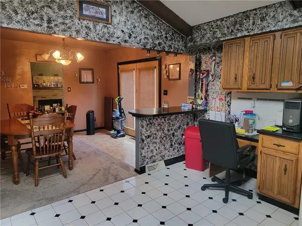 a room with furniture a window and a fireplace