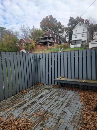 a view of a wooden fence