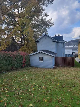 a house with trees in front of it