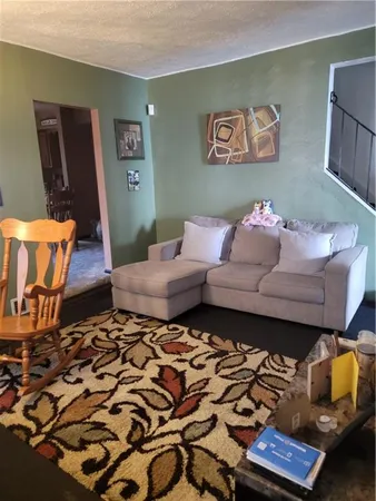 a living room with furniture and a couch