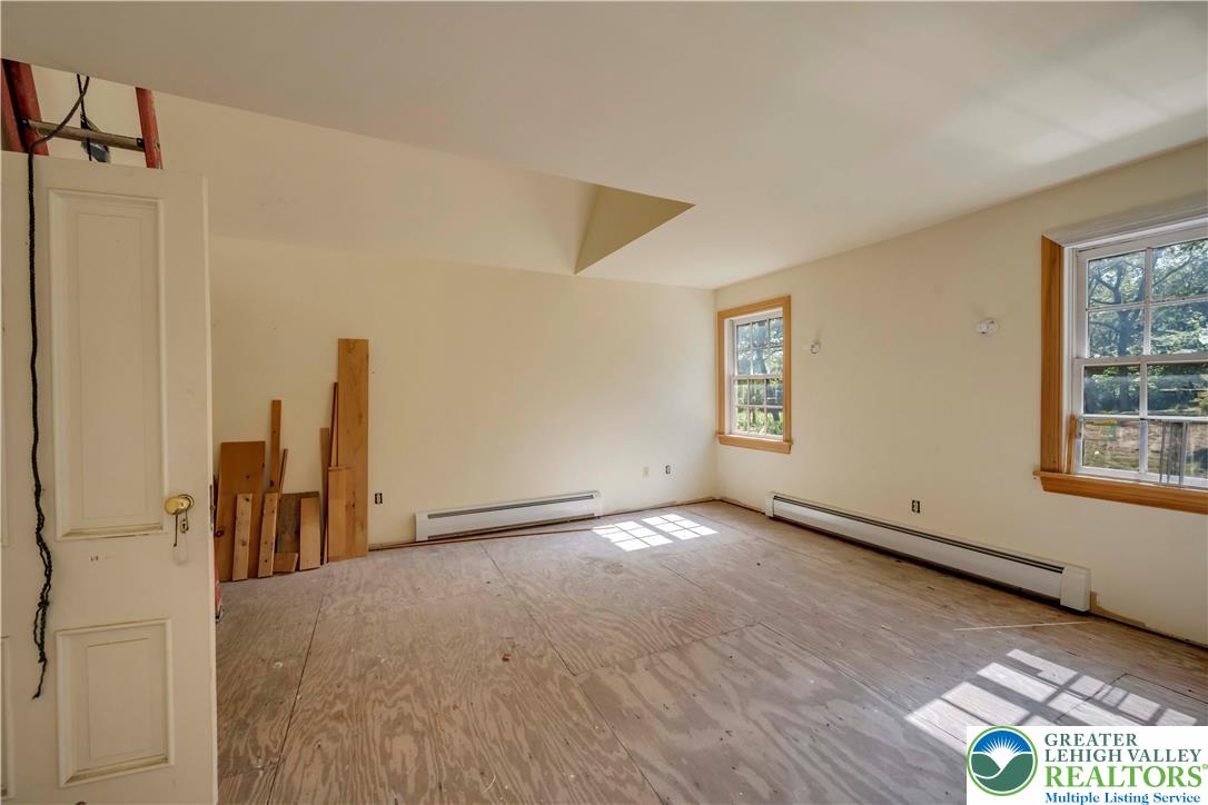 384 Henry Road Nazareth, PA 18064 - Photo 47 of 54 Natural light streams through wood-framed windows into this versatile upper-level space.