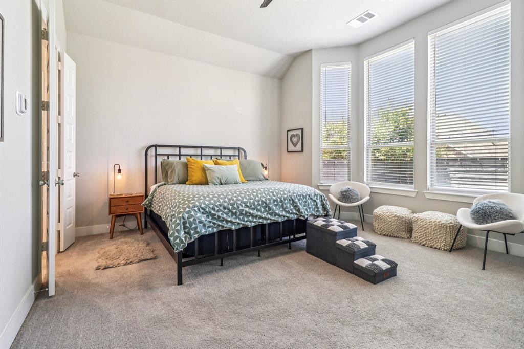 847 Longbranch Way Little Elm, TX 76227 - Photo 24 of 39 Carpeted bedroom featuring vaulted ceiling and a ceiling fan
