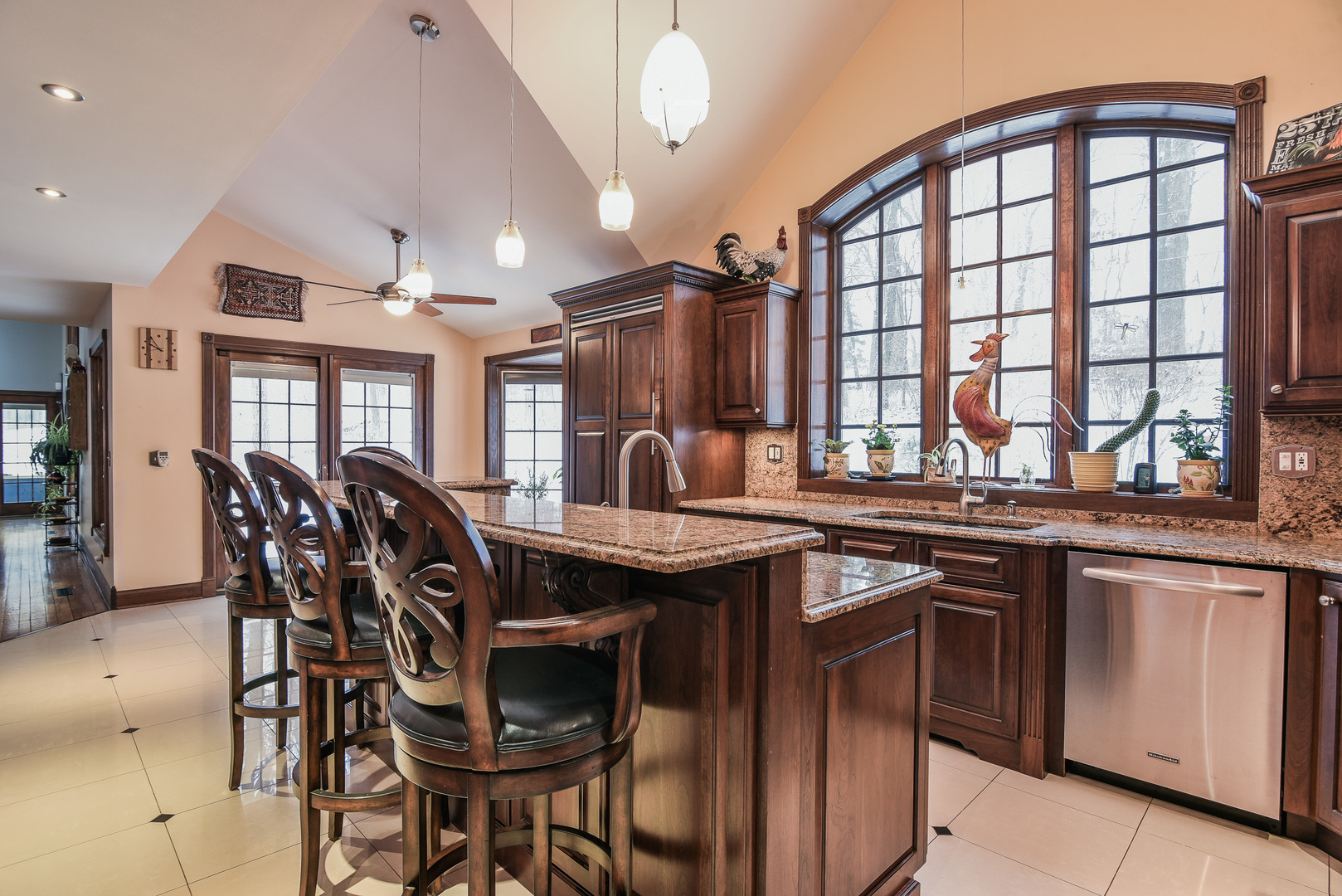 41W417 Farview Road Elburn, IL 60119 - Photo 12 of 29 a kitchen with stainless steel appliances granite countertop table chairs and wooden cabinets