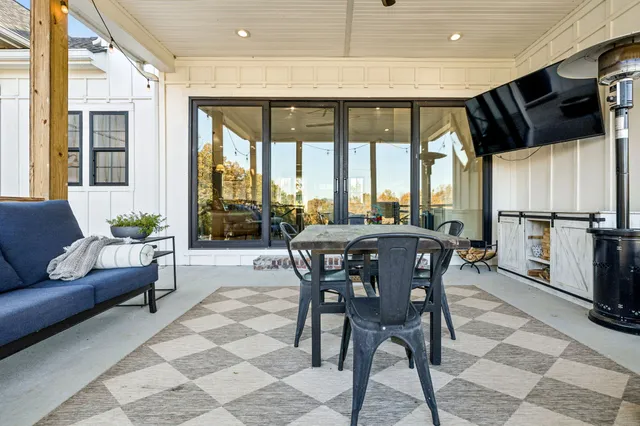 a dining room with a table and chairs