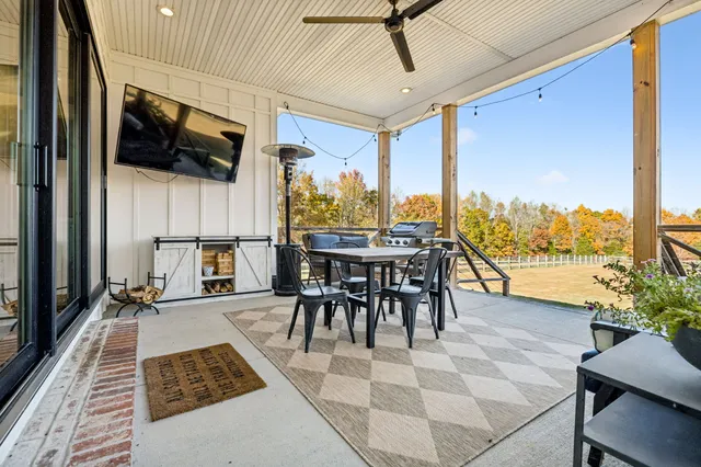 a view of a dining room with furniture window and outside view