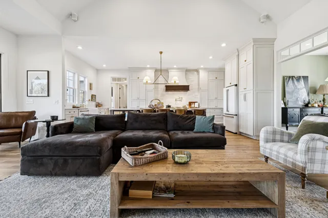a kitchen with stainless steel appliances a refrigerator and a stove top oven