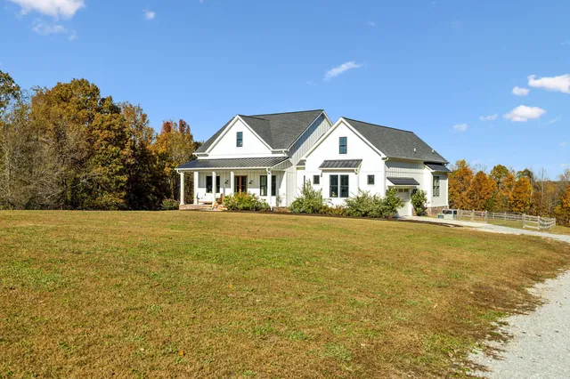 a bedroom with a bed and a lamp on table